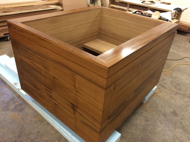 Custom extra large teak ofuro soaking tub with built in bench and sitting ledge.