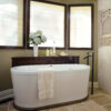 Tub with WaterBridge Floor Mount Tub Filler