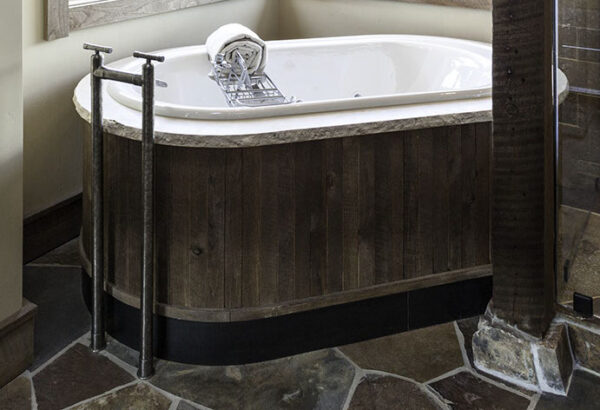 Tub with WaterBridge Floor Mount Tub Filler