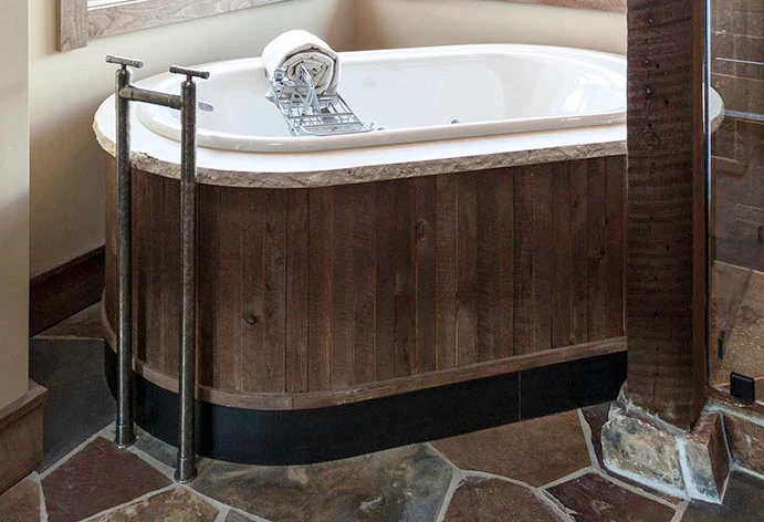 Tub with WaterBridge Floor Mount Tub Filler
